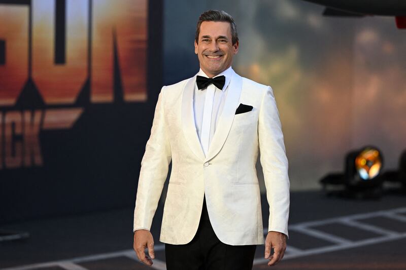 Jon Hamm wore a white tuxedo. AFP