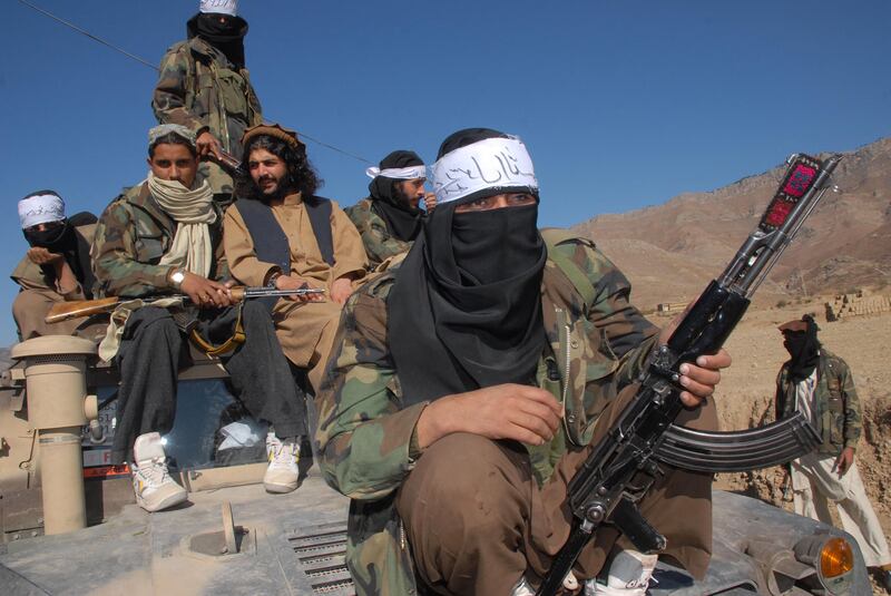 Pakistan's Taliban commander Latif Mehsud, centre, a close aide to the former chief of the Tehreek-e-Taliban Pakistan (TTP), Hakimullah Mehsud, sits on an armed vehicle in Khyber Pakhtunkhwa province. AFP