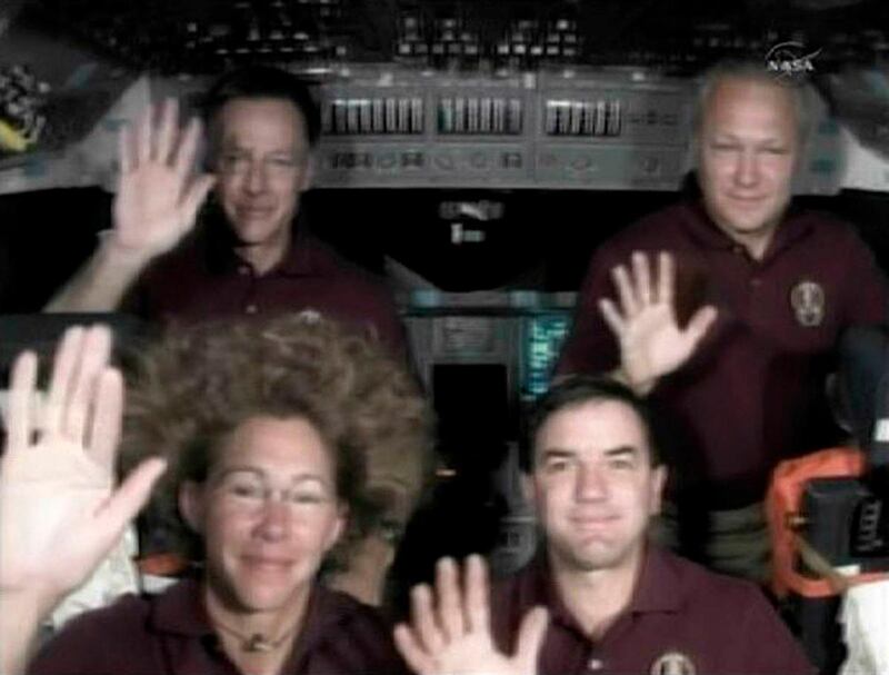The crew of the space shuttle Atlantis (L-R) Commander Chris Ferguson, Sandy Magnus, Rex Walheim and Pilot Doug Hurley wave farewell at the end of the last crew news conference from aboard a shuttle in this image from NASA TV July 20, 2011.     REUTERS/NASA TV/Handout    (UNITED STATES - Tags: SCI TECH) FOR EDITORIAL USE ONLY. NOT FOR SALE FOR MARKETING OR ADVERTISING CAMPAIGNS. THIS IMAGE HAS BEEN SUPPLIED BY A THIRD PARTY. IT IS DISTRIBUTED, EXACTLY AS RECEIVED BY REUTERS, AS A SERVICE TO CLIENTS *** Local Caption ***  HOU01_SPACE SHUTTLE_0720_11.JPG