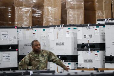 A US National Guard member stands beside crates of medical supplies in New York. The city also faces a potentially deadly dearth of ventilators to treat those infected by the coronavirus. AP