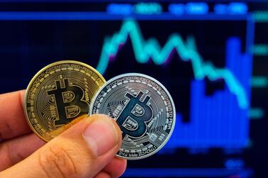 Bitcoin is seeing volatility in price as it slips below $10,000 on Sunday. AFP 