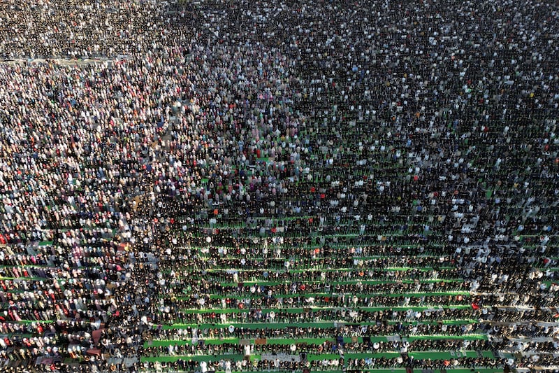 Albanian Muslims attend Eid Al Fitr prayers at Skanderbeg Square in Tirana. Reuters