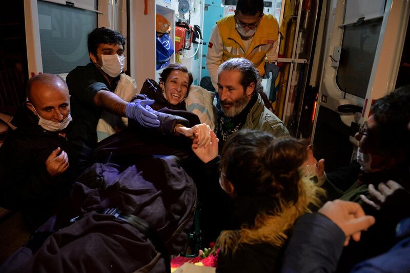 Nuriye Gulmen, a 35-year-old Turkish professor who has been on hunger strike since losing her job in a purge following last year's failed coup was convicted of belonging to a banned far-left group but the court ordered her release pending an appeal, reacts as she leaves an ambulance upon arrival at her home in Ankara, Turkey, December 2, 2017. REUTERS/Stringer NO RESALES. NO ARCHIVES     TPX IMAGES OF THE DAY