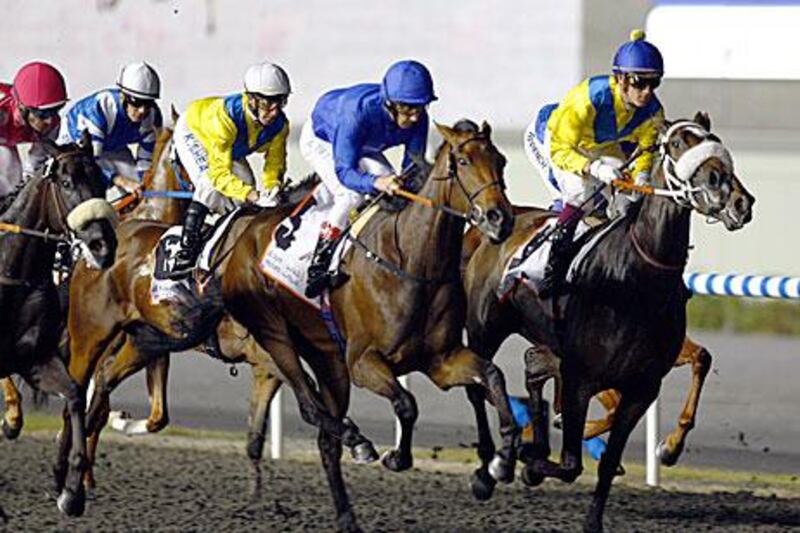 With Lanfranco Dettori aboard, Khawlah settles back in position to make a grab for the UAE Oaks at the Meydan racecourse.