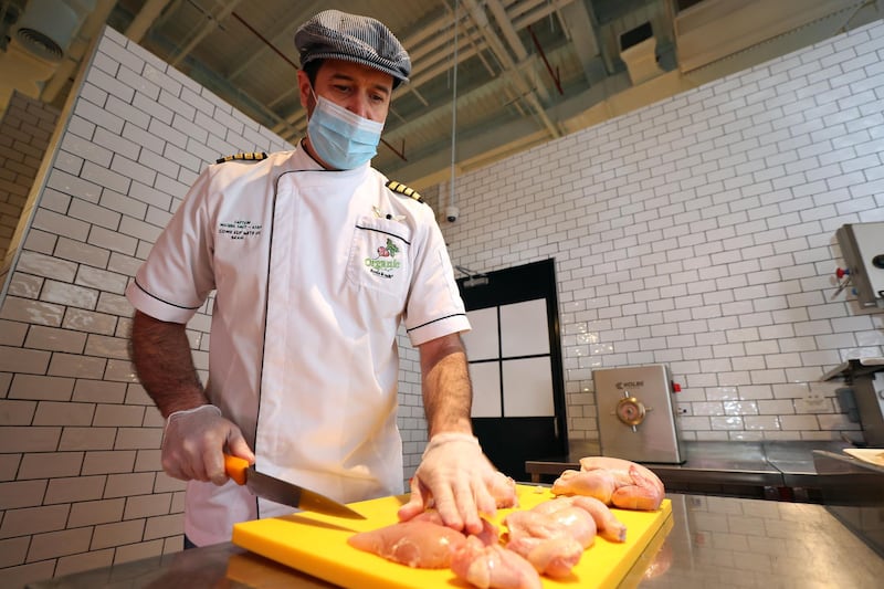 Michiel Smit. A group of South African pilots on unpaid leave for more than a year become specialist butchers at the Organic Cafe in Dubai on May 30th, 2021. Chris Whiteoak / The National. 
Reporter: Kelly Clark for News