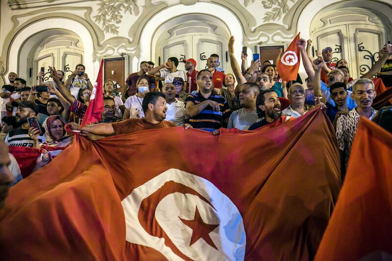 Protesters on the street of Tunisia's capital, Tunis. The country is struggling to boost economic growth amid a credit crunch and soaring inflation. AP