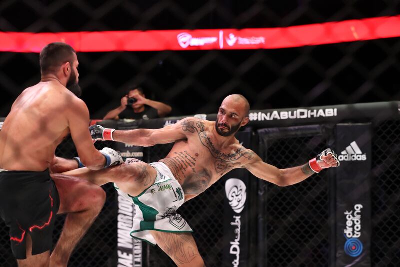 Josh Togo kicks Tahir Abdullaev during their welterweight titlle clash.