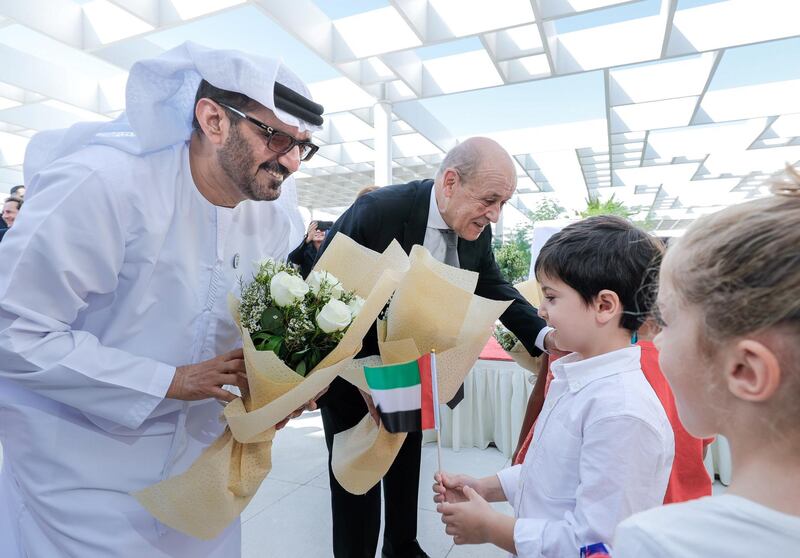 Abu Dhabi, United Arab Emirates, October 28, 2019.  
French Minister for Europe and Foreign affairs, Mr. Jean-Yves Le Drian, together with H.E. Hussain Ibrahim Al Hammadi, the Minister of Education, UAE, are given flowers by the primary school students of the Lycée Louis Massignon Abu Dhabi.
Victor Besa/The National
Section:  NA
Reporter: John Dennehy
