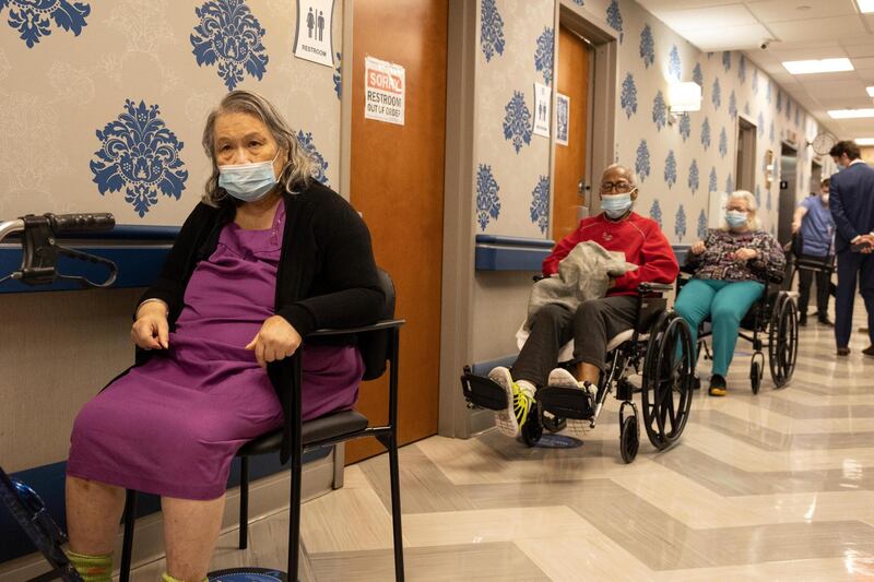 Nursing home residents line up for the coronavirus vaccine at Harlem Center for Nursing and Rehabilitation, a nursing home facility in New York. AP Photo