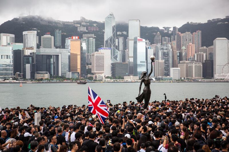 epa07700903 Anti-extradition bill protesters take part in a march to West Kowloon railway station in Hong Kong, China, 07 July 2019. The march aims to spread the spirit of resistance all over the land from Hong Kong Island to Kowloon, and even to Mainland China, according to the organizers.  EPA/CHAN LONG HEI