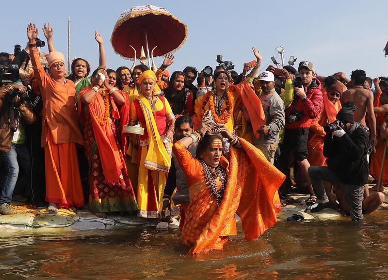 epaselect epa07285371 Head of Kinnar Akhara, a transgender congregation, Laxmi Narayan Tripathi (C, front) and members take a 'shahi snans' or holy bath at the Sangam river, the confluence of three of the holiest rivers in Hindu mythology, the Ganga, the Yamuna and the Saraswati, during Kumbh Mela festival in Allahabad, Uttar Pradesh, India, 15 January 2019. The Hindu festival is one of the biggest in India and will be held from 15 January to 04 March 2019 in Allahabad.  EPA/RAJAT GUPTA