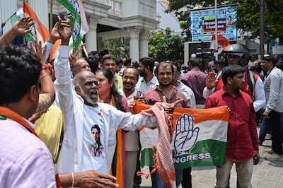 Congress supporters celebrate in front of the Karnataka Pradesh Congress Committee office in Bengaluru. AFP