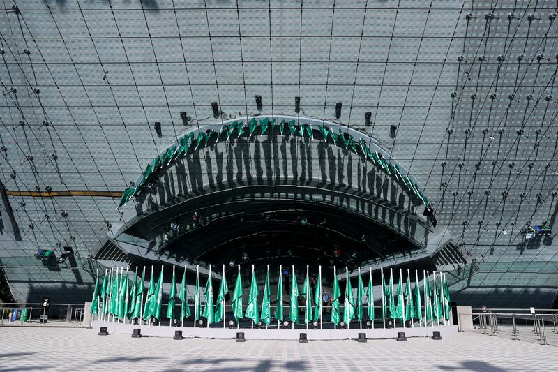 Flags outside the Saudi Arabia pavilion for the country's national day.