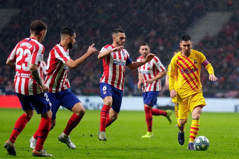 Messi controls the ball at Wanda Metropolitano. AP