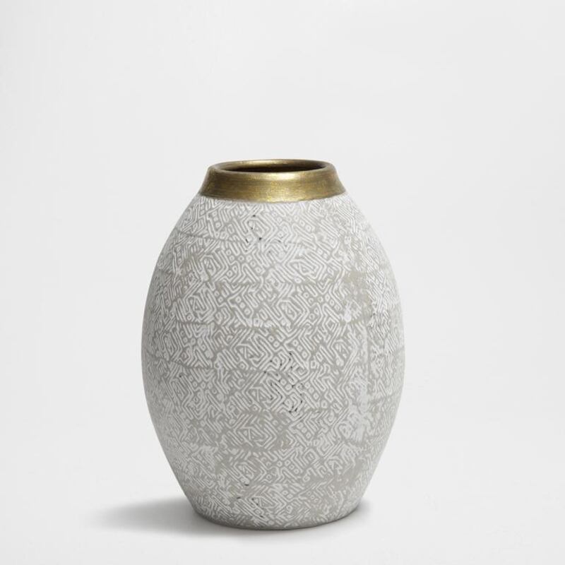 This vase from Zara Home will make a subtle statement on your bedside table. Its simple form is combined with a lightly textured finish and topped with a striking gold rim. Vase, Dh209, Zara Home stores across the UAE. Courtesy of Zara Home