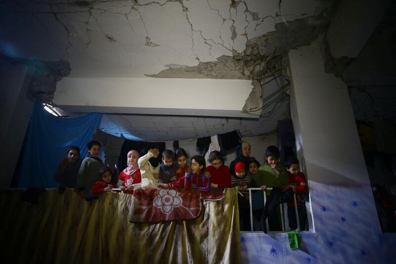 Children in a shelter in the government-besieged Syrian town of Douma on March 11, 2018. Three weeks of heavy government bombardment has forced thousands of families in Eastern Ghouta to seek safety in basements that are becoming increasingly crowded. Bassam Khabieh / Reuters