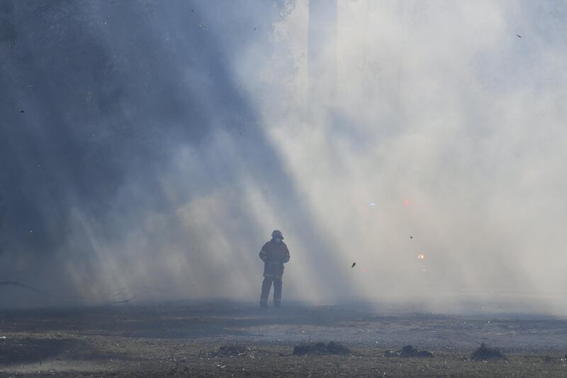 A New South Wales firefighter works on containing an out of control bushfire in near Nowra, New South Wales, Australia. Lukas Coch/EPA