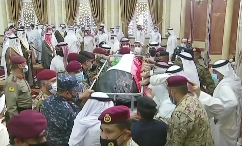 People carry the body of the late Emir Sheikh Sabah al-Ahmad al-Sabah after funeral prayers in Kuwait City, Kuwait, September 30, 2020, in this still image taken from a video. Kuwait TV/Handout via REUTERS ATTENTION EDITORS - THIS IMAGE WAS PROVIDED BY A THIRD PARTY. NO RESALES. NO ARCHIVES KUWAIT OUT. NO COMMERCIAL OR EDITORIAL SALES IN KUWAIT