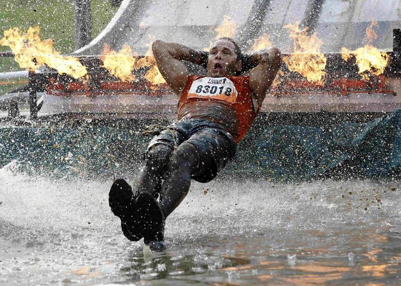 A competitor participates in the Tough Mudder challenge near Winchester in southern England on Saturday. Luke MacGregor / Reuters
