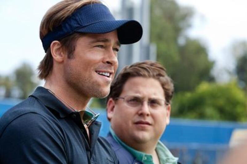 Brad Pitt, left, and Jonah Hill star in Moneyball, a film based on Michael Lewis’s story Moneyball: The Art of Winning an Unfair Game. Courtesy Columbia Pictures