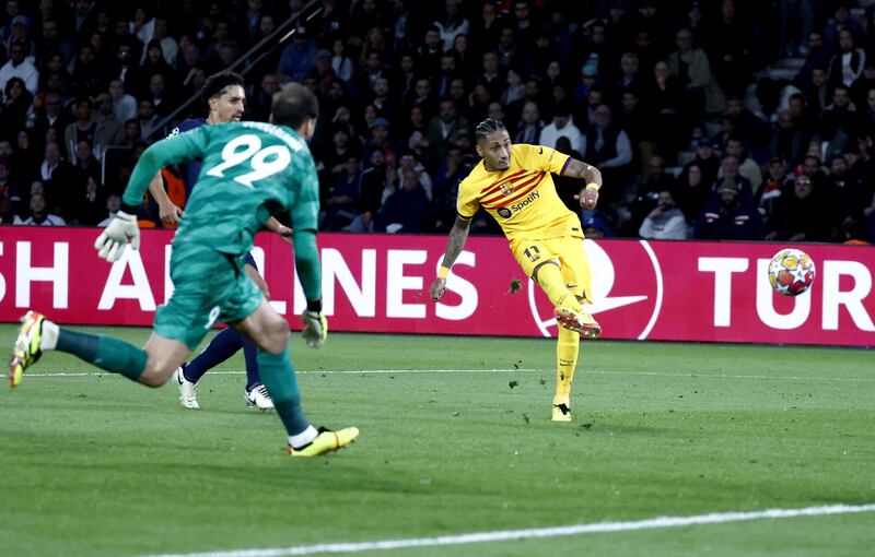 Raphinha opens the scoring for Barcelona against PSG at the Parc des Princes. EPA