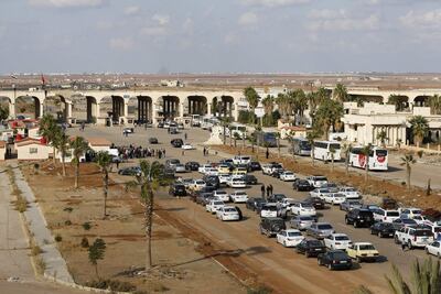 Vehicles wait to cross into Syria at the recently reopened Nassib/Jaber border post in the Deraa province, at the Syrian-Jordanian border south of Damascus. AFP