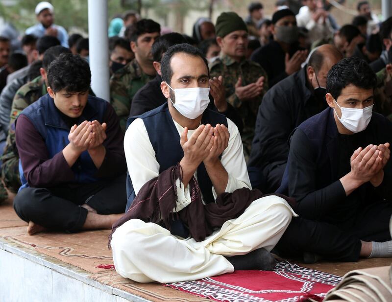 Muslims wear protective masks and attend Friday prayers at a mosque, amid concerns about the spread of coronavirus, in Kabul, Afghanistan on March 20, 2020. Reuters