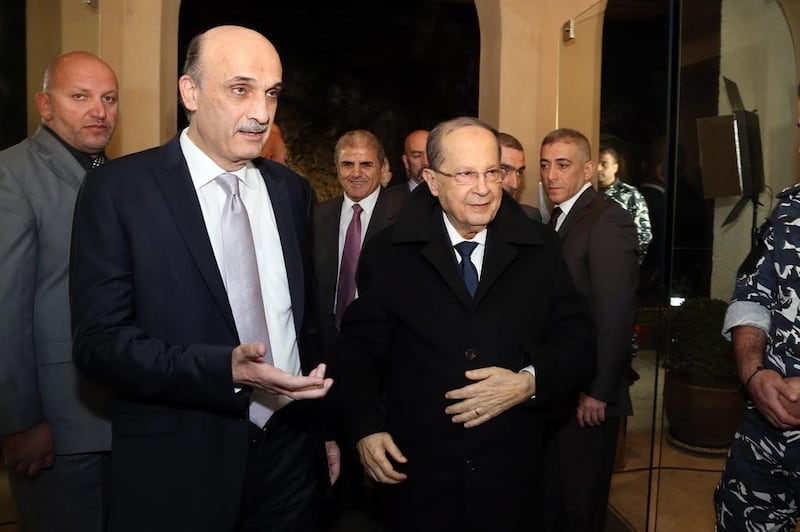 Samir Geagea (C-L) welcomes Michel Aoun (C-R) to his headquarters in Maarab, north-east of Beirut, on January 18, 2016. Aldo Ayoub/Lebanese Forces/AFP



