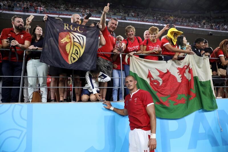 Aaron Shingler of Wales poses with fans after the match. Reuters