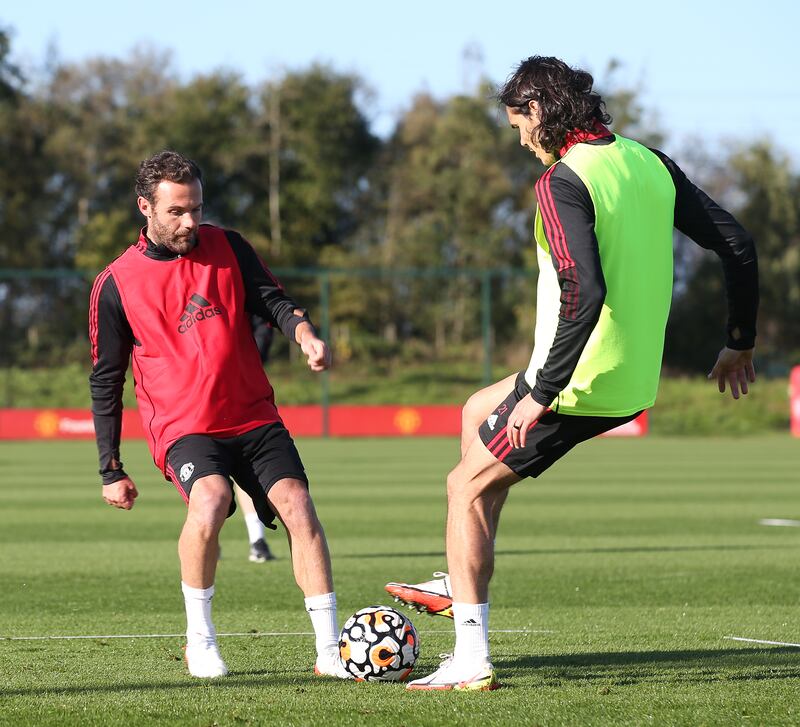 Juan Mata and Edinson Cavani during training. Getty