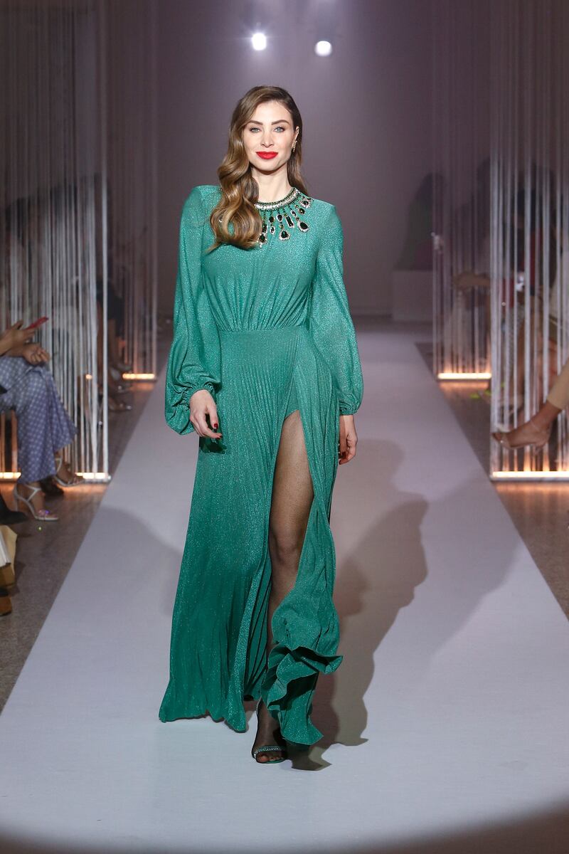 Lebanese presenter Annabella Hilal also walked the runway.