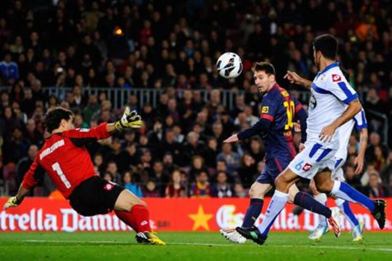 Barcelona's Lionel Messi scores his side's second goal against Deportivo La Coruna.