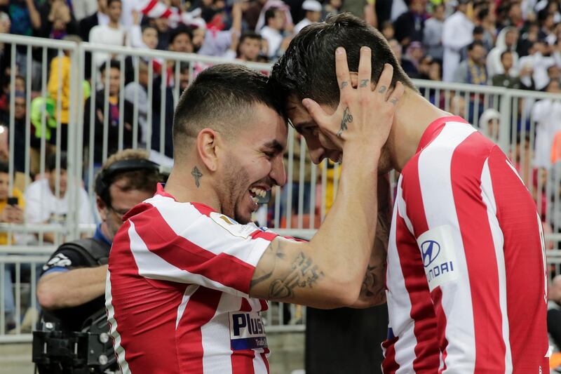 Atletico Madrid's Angel Correa, left, celebrates with Alvaro Morata after scoring the winner. AP