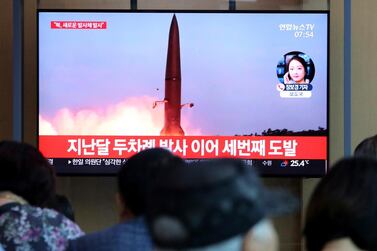 People in Seoul watch a TV report on North Korea's latest missile launch on August 2, 2019. The caption on the screen says: "The third provocation." AP Photo