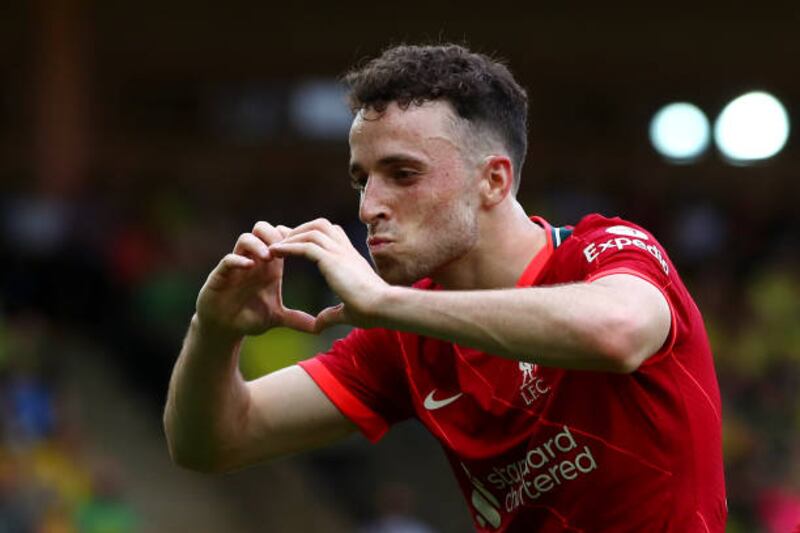 Diogo Jota of Liverpool celebrates after scoring their side's first goal during the Premier League match at Norwich City.