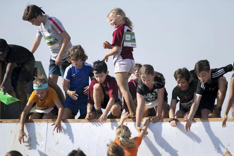 DUBAI, UNITED ARAB EMIRATES - DECEMBER 7, 2018. 

Children participate in the mini Tough Mudder challenge in Hamdan Sports Complex.

du Tough Mudder is a mud and obstacle course designed to test participant's physical strength, stamina, and mental grit. It is a team-oriented challenge with no winners, finisher medals, or clocks to race against. 

(Photo by Reem Mohammed/The National)

Reporter:
Section:  NA