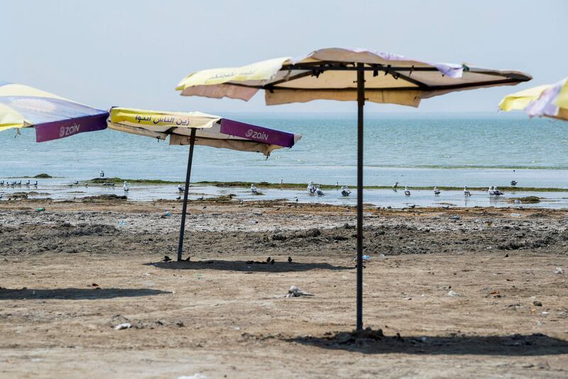 A picture shows empty tourist facilities by the Habbaniyah lake affected by severe drought in Iraq's Anbar province, August 11. The sustainability of nature, land use, and oceans are integral to achieving all the Paris Agreement’s goals. AFP