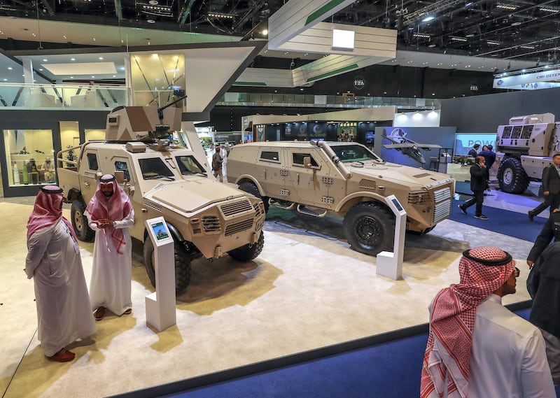 Abu Dhabi, U.A.E., February 20, 2019. INTERNATIONAL DEFENCE EXHIBITION AND CONFERENCE  2019 (IDEX) Day 4--  Visitors look at the military vehicles at the Saudi Arabia area stands..
Victor Besa/The National
Section:  NA