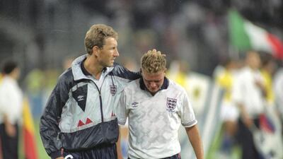 Terry Butcher (left) of England consoles team mate Paul Gascoigne after the World Cup semi-final against West Germany at the Delle Alpi Stadium in Turin, Italy. Allsport UK