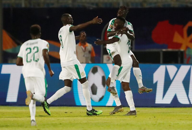 Senegal's Krepin Diatta celebrates scoring their second goal with Ismaila Sarr and teammates. Reuters