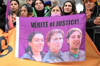 A banner calling for "truth and justice" shows the faces of 2013 shooting victims Fidan Dogan, Sakine Cansiz and Leyla Saylemez. AFP 