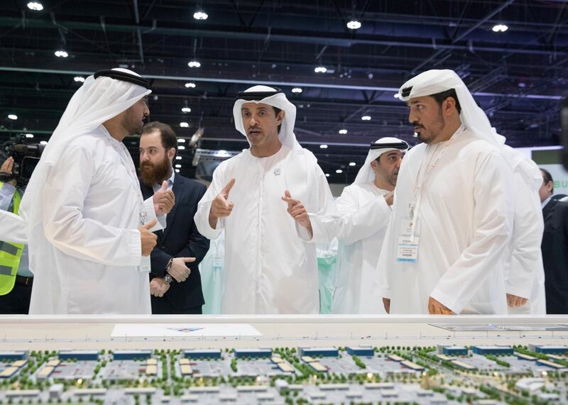 ABU DHABI, UNITED ARAB EMIRATES - April 16, 2019: HH Sheikh Hazza bin Zayed Al Nahyan, Vice Chairman of the Abu Dhabi Executive Council (C), attends the opening of Cityscape Abu Dhabi, at Abu Dhabi National Exhibition Centre (ADNEC). Seen with HE Falah Mohamed Al Ahbabi, Chairman of the Department of Urban Planning and Municipalities and Abu Dhabi Executive Council Member (L).

( Mohammed Al Blooshi for Ministry of Presidential Affairs )
---