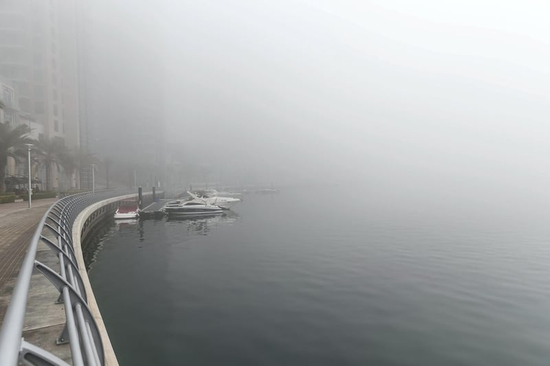 DUBAI, UNITED ARAB EMIRATES. 24 DECEMBER 2017. Heavy morning fog envelopes the city. Views along the Marina Promenade. (Photo: Antonie Robertson/The National) Journalist: None. Section: National.