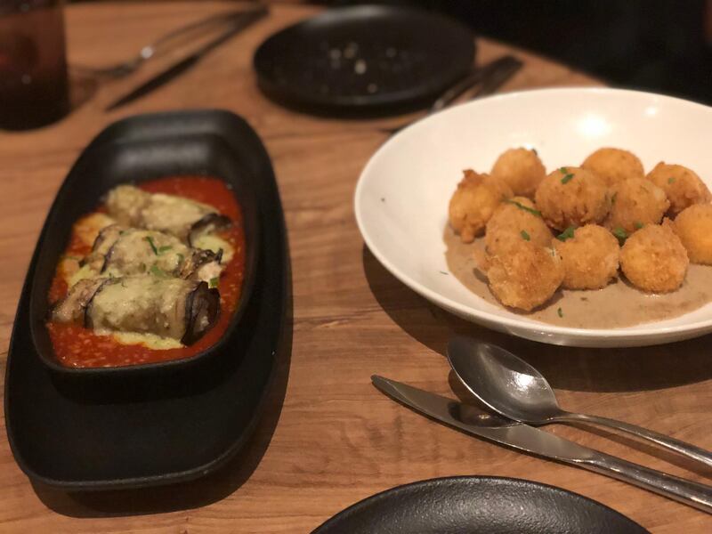 Oven-baked eggplant involtini and fried mozzarella di bufala starters at Si Ristorante Italiano. Photo: Sophie Prideaux