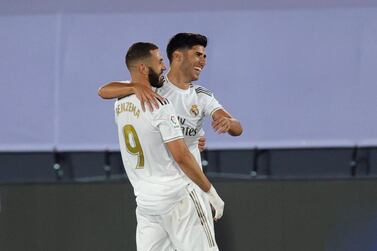 Real Madrid forward Marco Asensio (R) celebrates with striker Karim Benzema after scoring against Deportivo Alaves. EPA