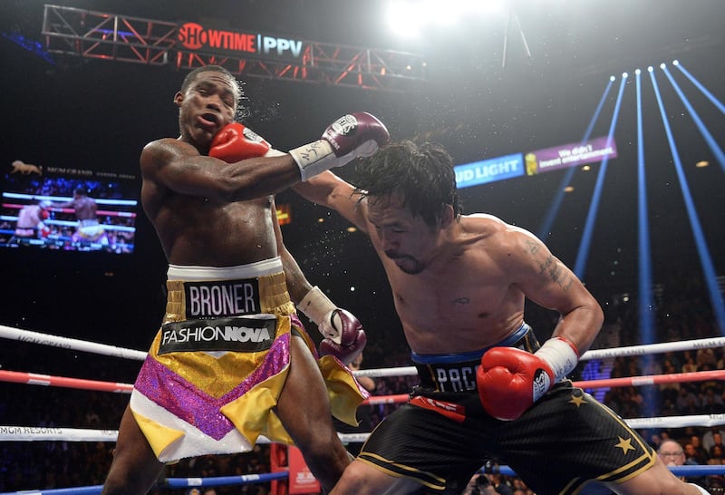 Manny Pacquiao and Adrien Broner in action. Reuters