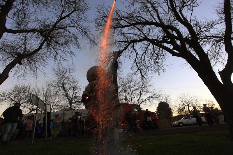 A man fires a rocket among local indigenous people commemorating the start of their Purepecha New Year with a hike through wooded and mountainous trails in Michoacan state, Mexico. The Purepechas, the main ethnic group of Michoacan, each February celebrate a new year, walking with the 'Grandfather Fire' among the villages as an ancestral tradition that coincides with the agricultural cycle of the Mexican West.  EPA