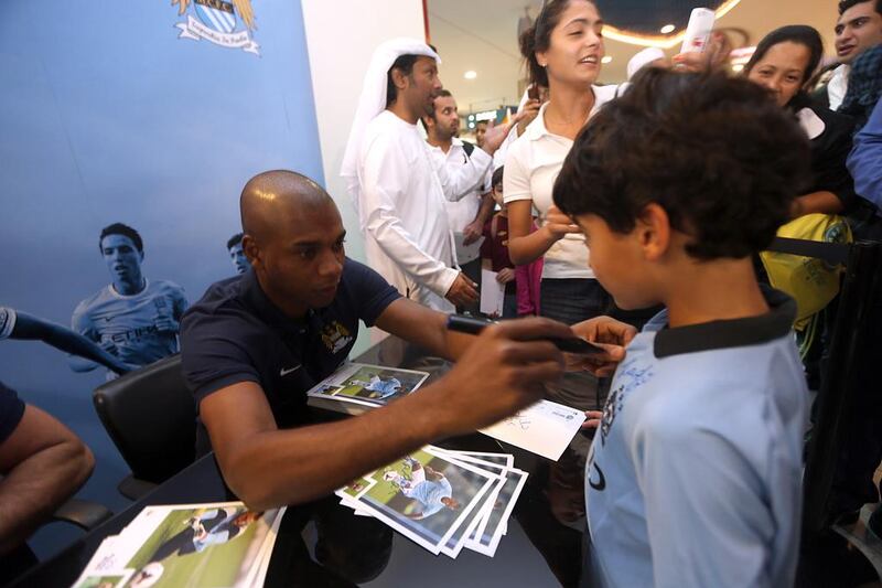 Manchester City midfielder Fernandinho signs autographs at the City Store at Abu Dhabi’s Marina Mall in November. Sammy Dallal / The National


