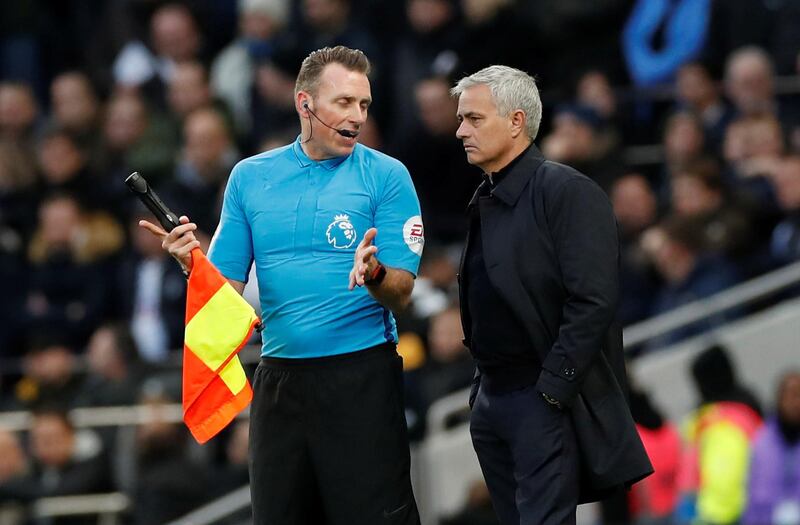 Tottenham Hotspur manager Jose Mourinho speaks with an assistant referee. Reuters