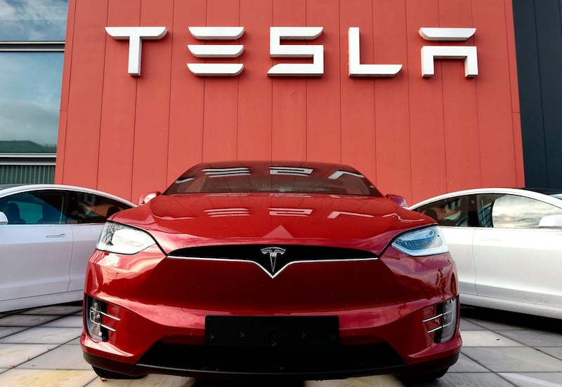 The logo marks the showroom and service center for the US automotive and energy company Tesla in Amsterdam on October 23, 2019. / AFP / JOHN THYS
